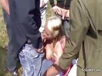 Blonde surrounded by gang