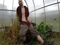 Horny dude masturbating in the field