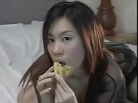Asian girls eating bananas