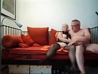 Horny grandmother gets herself off the couch until her man comes to help.