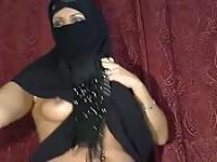 Arab woman takes out her tits and pussy and shows off