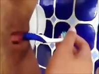 Toothbrush in her pussy